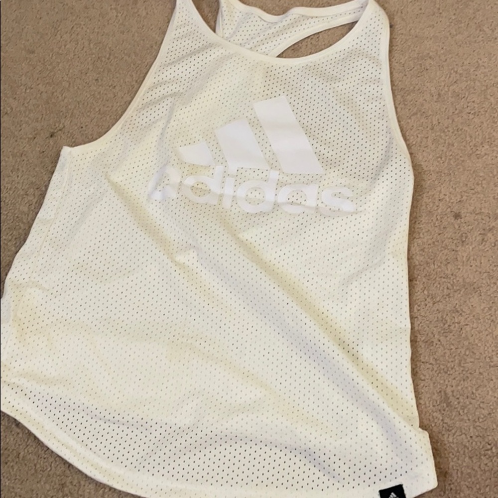 Adidas tank will fit small or medium